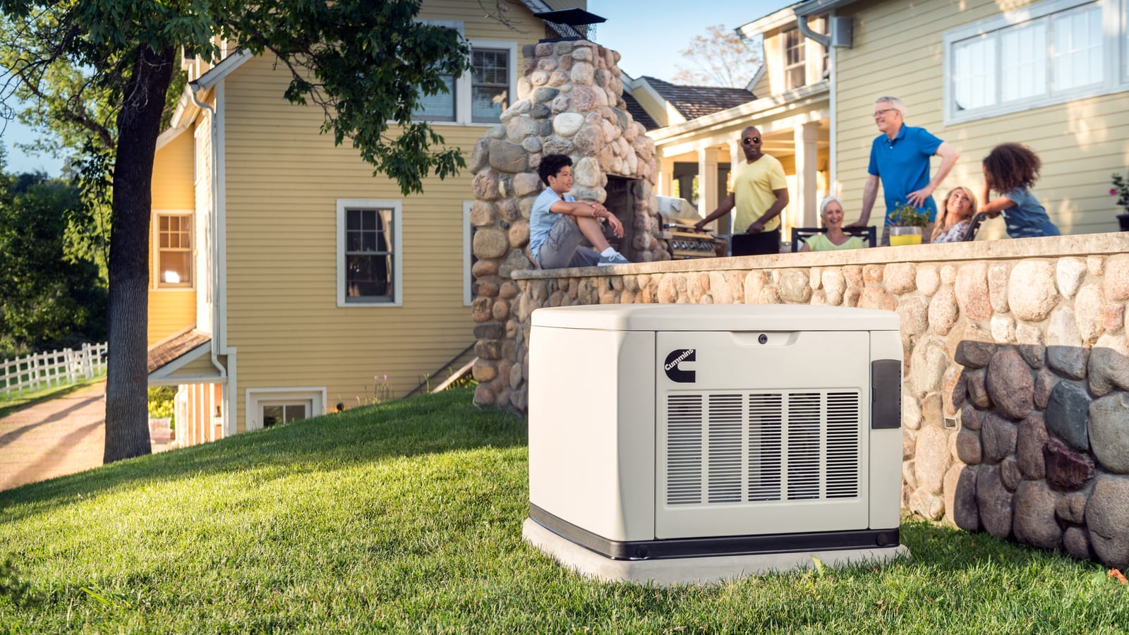 Cummins air-cooled home standby generator beside a backyard patio