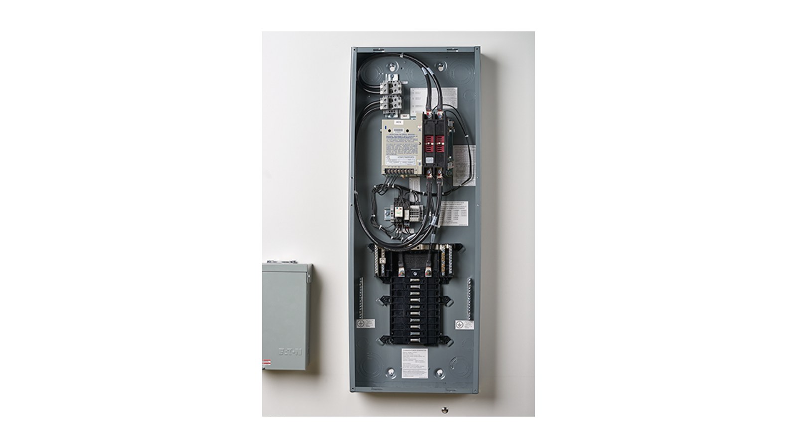 Cummins transfer switch and load center mounted on a wall