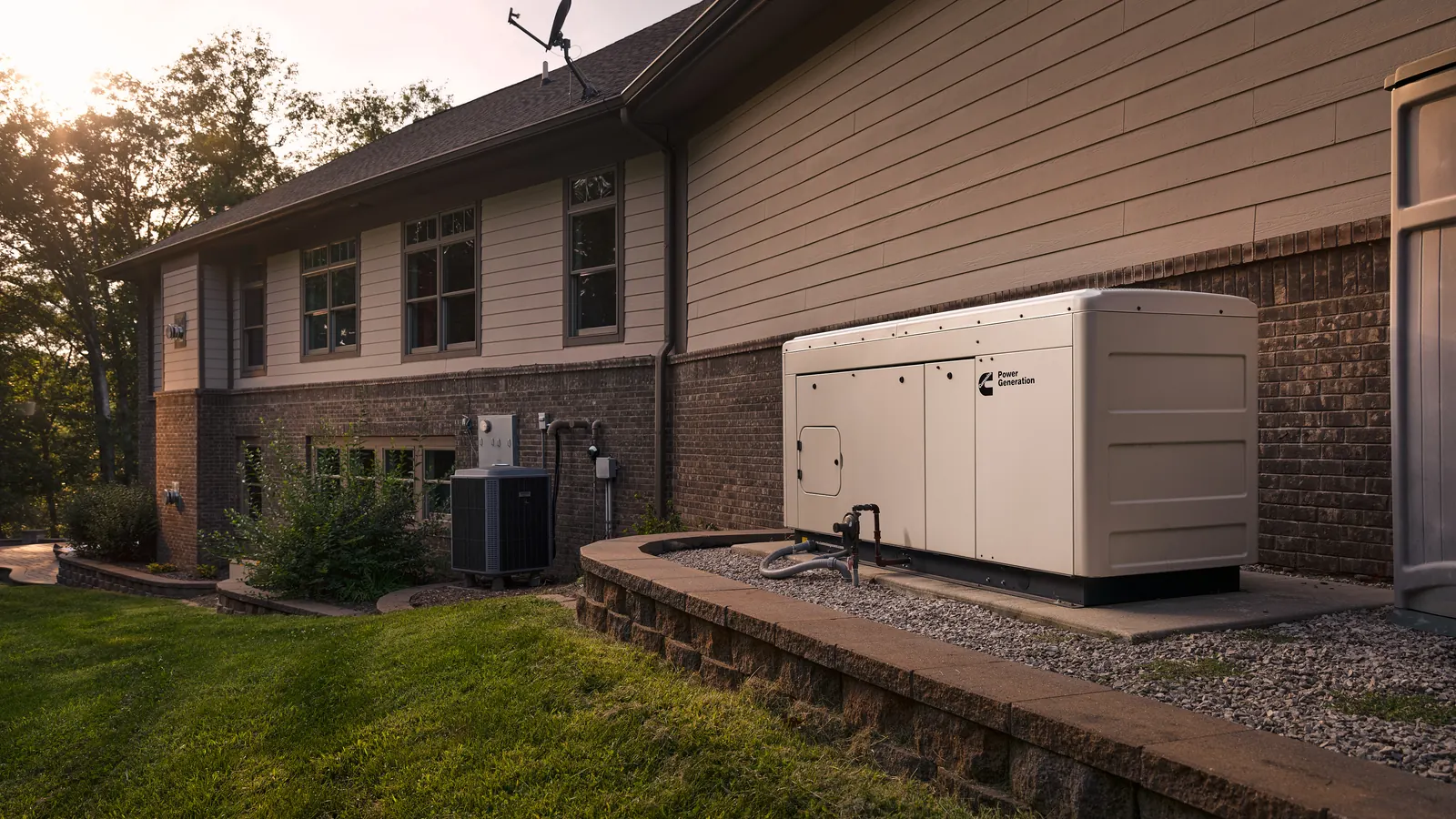 A Cummins Connect Series liquid-cooled standby generator on a pad beside a two-story house at sunset, with the air conditioning condenser and gas piping alongside it