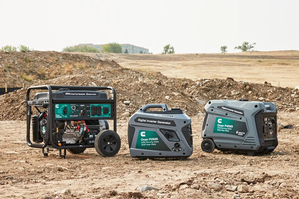 Three Cummins Onan portable generators side by side: the open-frame P9500df conventional dual-fuel set, and the enclosed P2500i and P4500i digital inverter generators