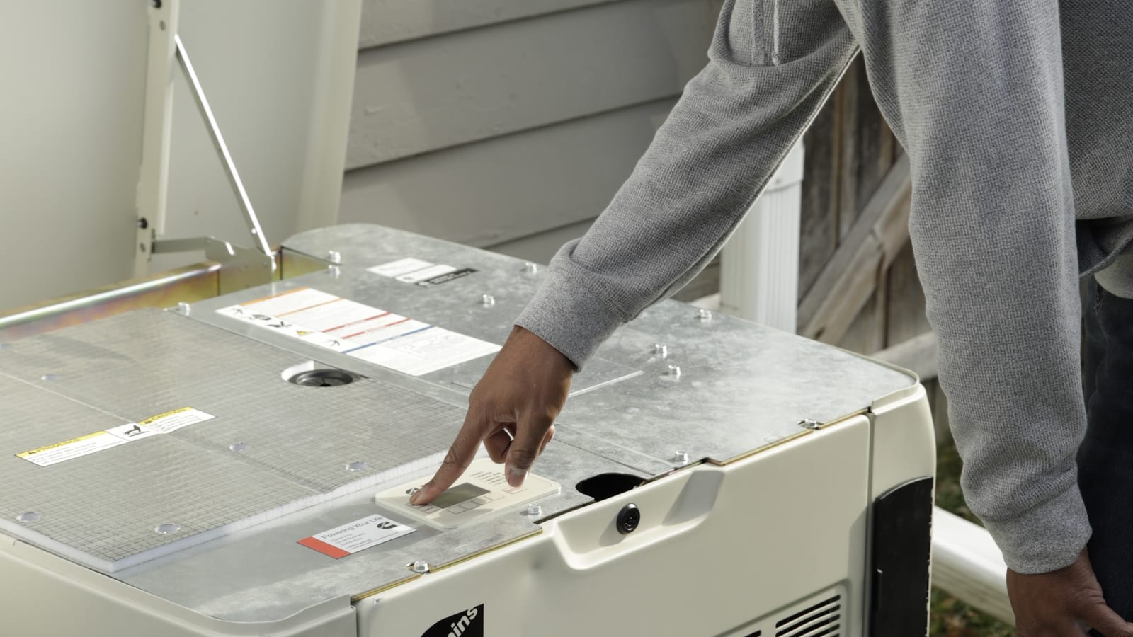 Service access lid open on a Cummins air-cooled home standby generator