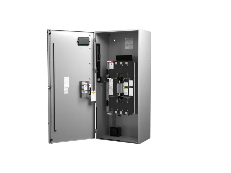 Cummins automatic transfer switch cabinet with the door open, showing the switching mechanism and controller